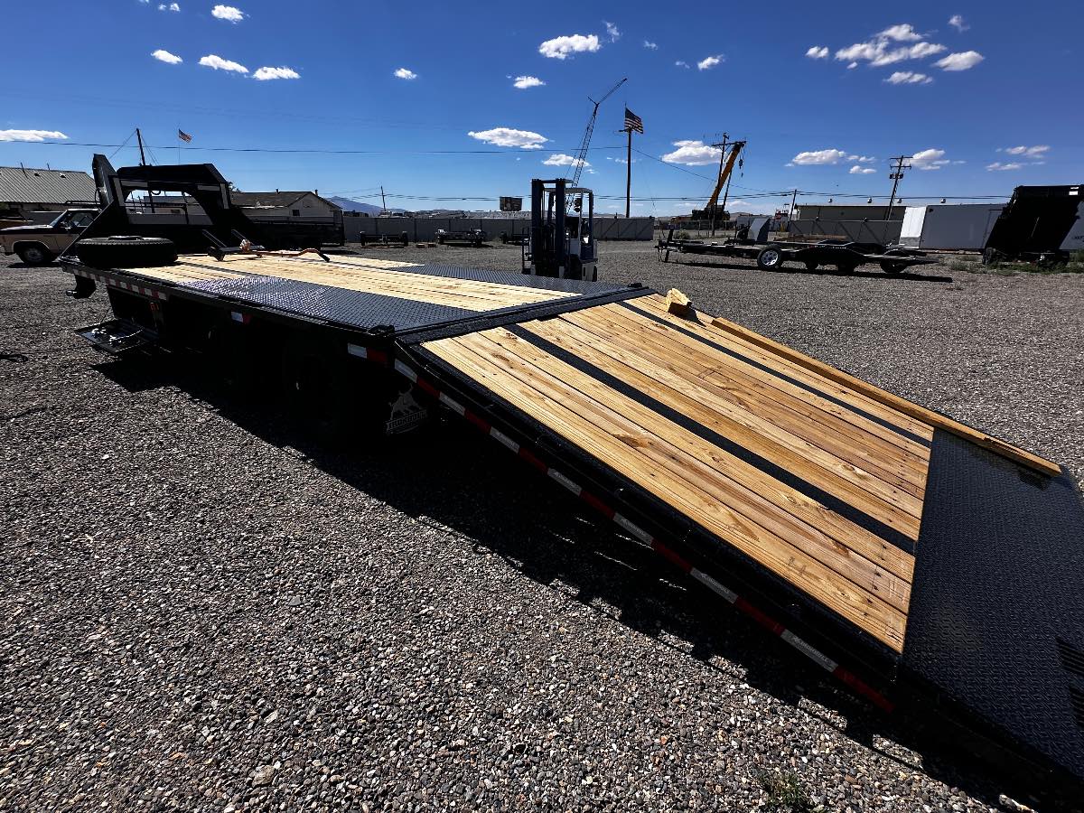 2027 Iron Bull 28' HYDRAULIC DOVETAIL New equipment / flatbed trailer, 28'X102", 22,000 lb GVWR, for sale at The Trailer Store in Winnemucca, Nevada (I-80), stock #TTS-V1916482 — rear and ramp view