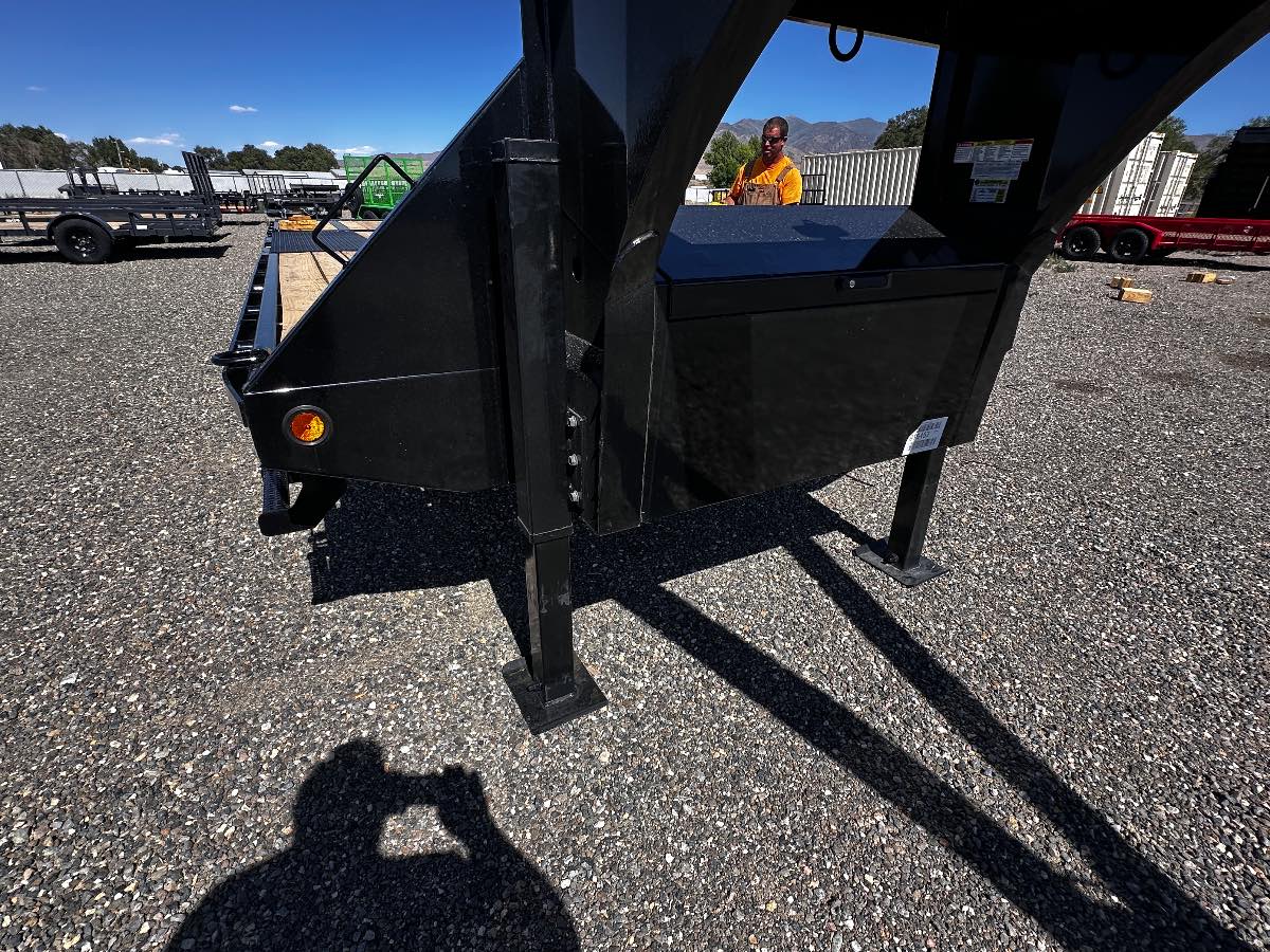 2027 Iron Bull 28' HYDRAULIC DOVETAIL New equipment / flatbed trailer, 28'X102", 22,000 lb GVWR, for sale at The Trailer Store in Winnemucca, Nevada (I-80), stock #TTS-V1916482 — hitch and tongue detail