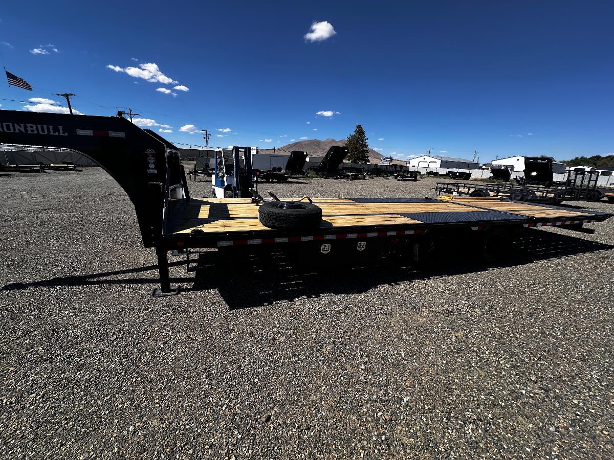 2027 Iron Bull 28' HYDRAULIC DOVETAIL New equipment / flatbed trailer, 28'X102", 22,000 lb GVWR, for sale at The Trailer Store in Winnemucca, Nevada (I-80), stock #TTS-V1916482 — front view