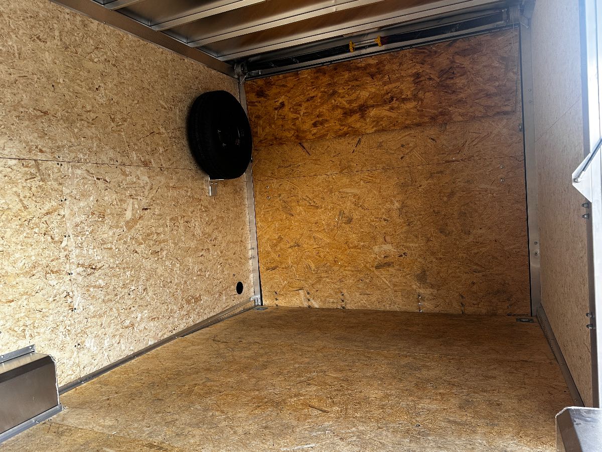 2026 EZ Hauler EZEC8.5X24CH-IF New cargo trailer, 8.5X24, 9,990 lb GVWR, for sale at The Trailer Store in Winnemucca, Nevada (I-80), stock #TTS-B053962 — hitch and tongue detail