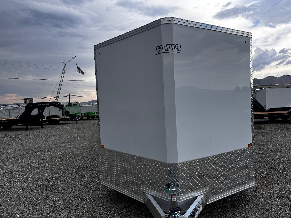 2026 EZ Hauler EZEC8.5X24CH-IF New cargo trailer, 8.5X24, 9,990 lb GVWR, for sale at The Trailer Store in Winnemucca, Nevada (I-80), stock #TTS-B053962 — rear and ramp view