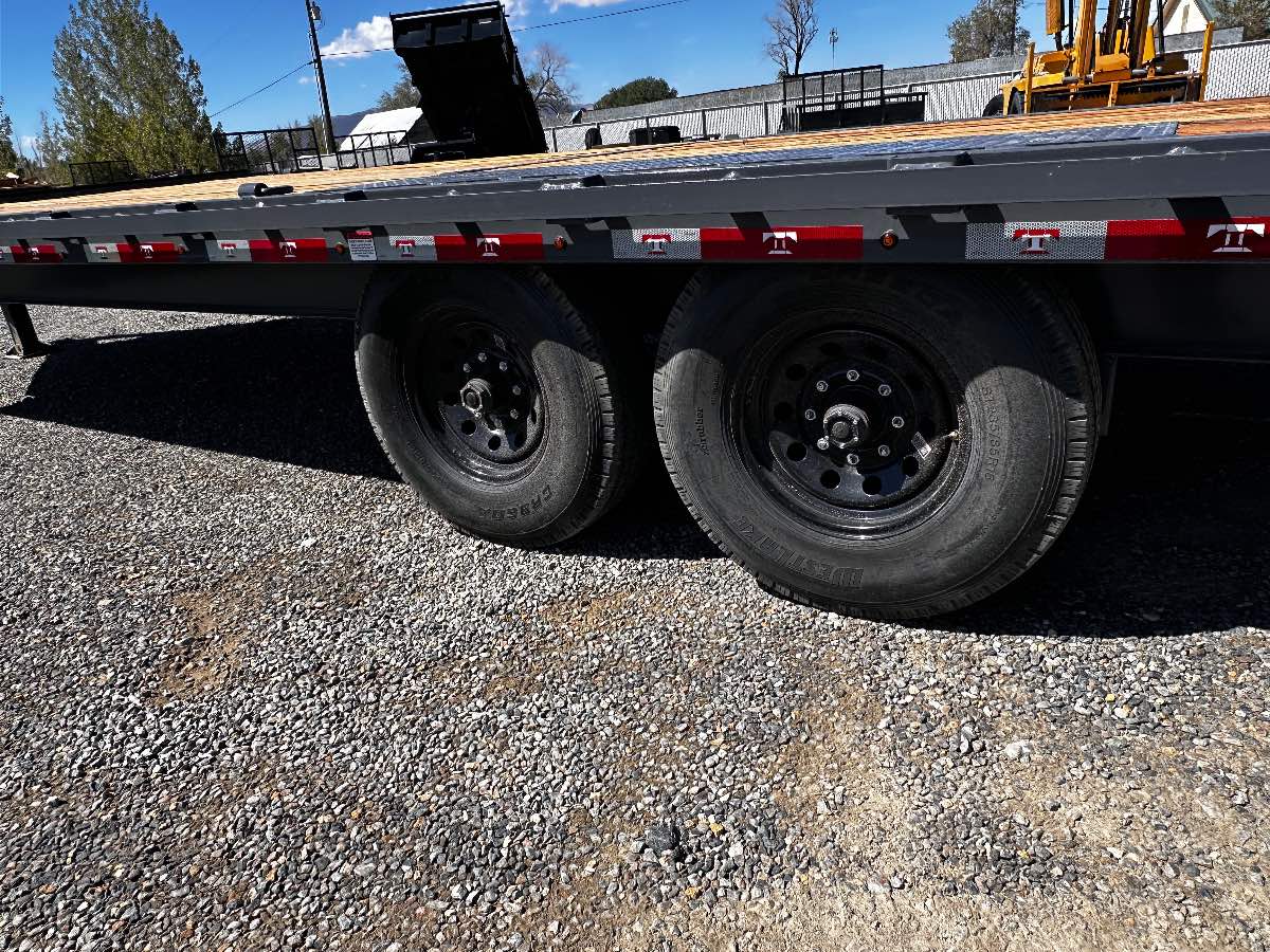 2026 Teton 20+5 DECKOVER New equipment / flatbed trailer, 102X25, 16,000 lb GVWR, for sale at The Trailer Store in Winnemucca, Nevada (I-80), stock #TTS-F400161 — rear and ramp view